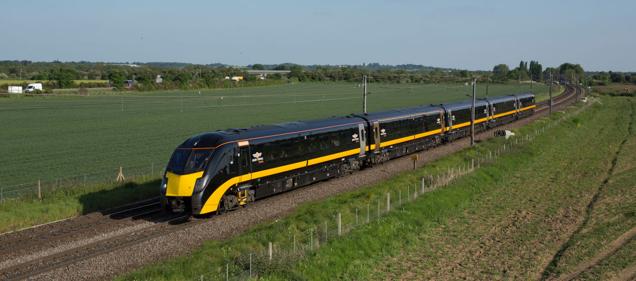 Grand Central Train driving through English countryside