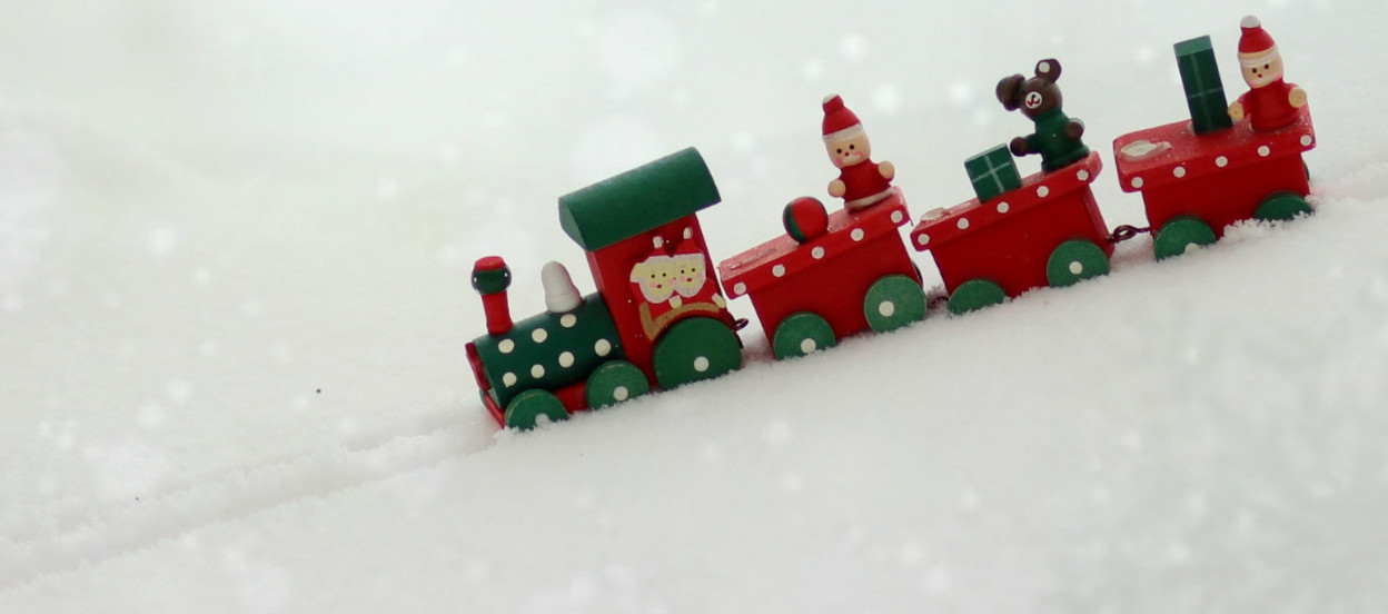 A toy Christmas train in the snow