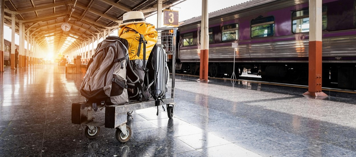 Luggage in trolley on train platform
