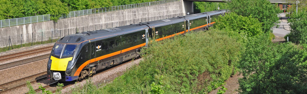 Grand Central train driving through green area