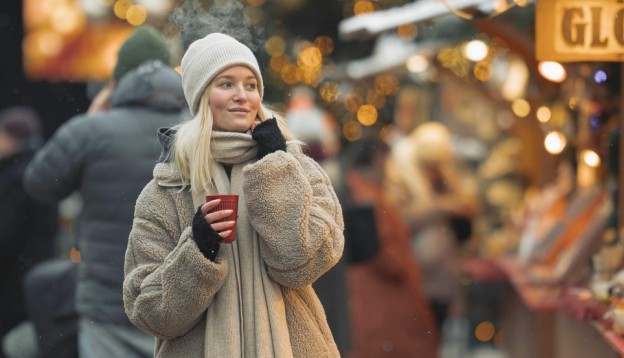 woman wandering christmas markets
