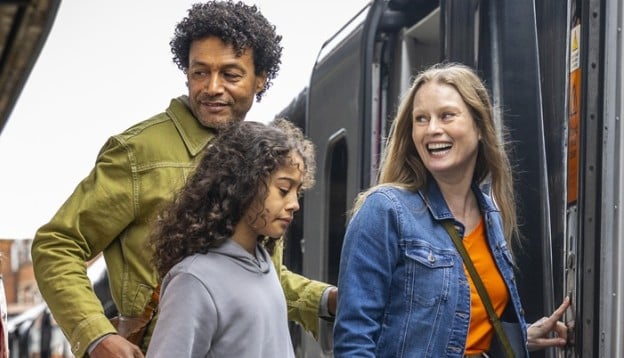 Family walking on a Grand Central train