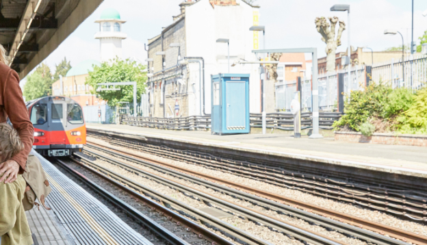 Mother and sons on the train station platform 