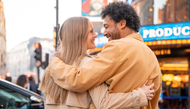 Couple with their arms round each other in London 