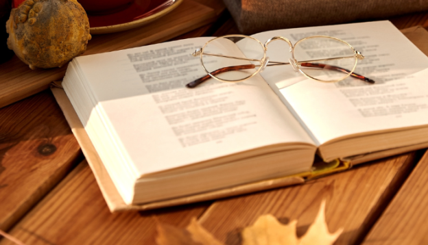 Autumn leaves with book on a table for study 