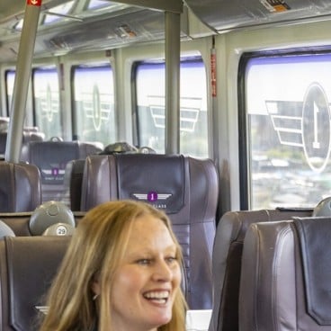 Employee walking down the train 